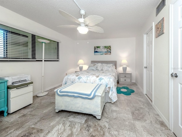 401 Airport Ave E Unit 304, Venice, FL 34285 - bedroom with a textured ceiling and a ceiling fan