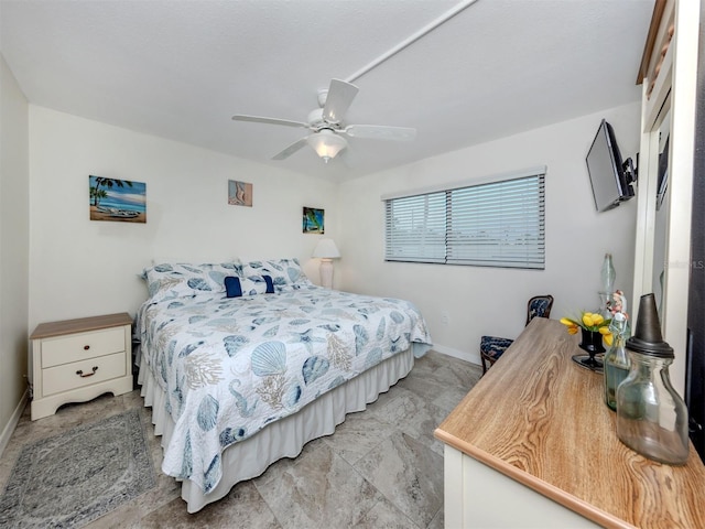 401 Airport Ave E Unit 304, Venice, FL 34285 - bedroom with baseboards and a ceiling fan