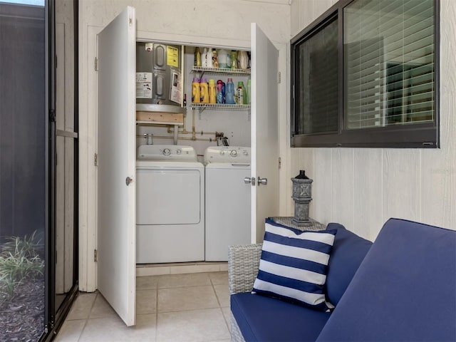 401 Airport Ave E Unit 304, Venice, FL 34285 - laundry area featuring washer and dryer and light tile patterned floors
