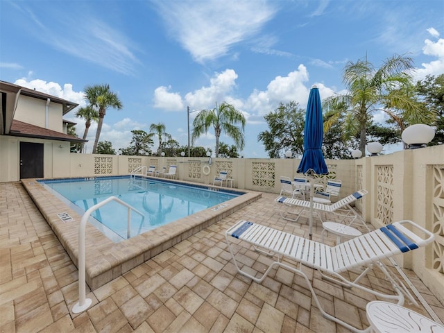 401 Airport Ave E Unit 304, Venice, FL 34285 - community pool with a patio and a fenced backyard