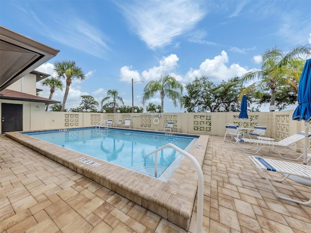 401 Airport Ave E Unit 304, Venice, FL 34285 - community pool featuring a patio and a fenced backyard
