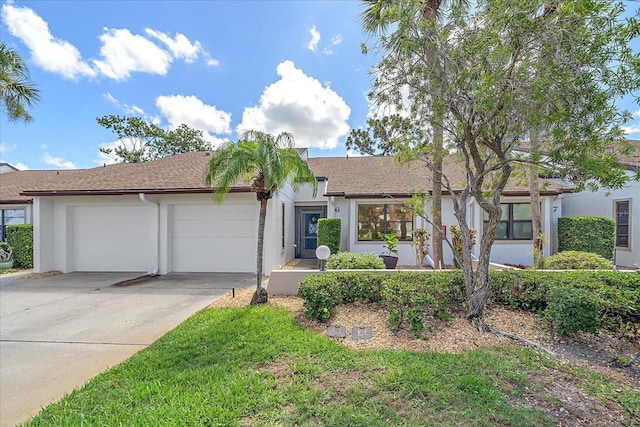 1211 Capri Isles Blvd Unit 6, Venice, FL 34292 - ranch-style house with an attached garage, concrete driveway, stucco siding, and a shingled roof