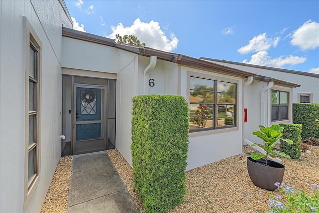 1211 Capri Isles Blvd Unit 6, Venice, FL 34292 - property entrance with stucco siding