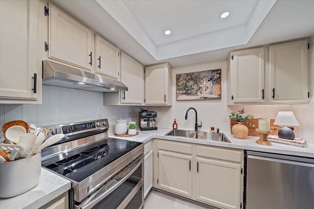 1211 Capri Isles Blvd Unit 6, Venice, FL 34292 - kitchen featuring stainless steel appliances, under cabinet range hood, light countertops, and recessed lighting