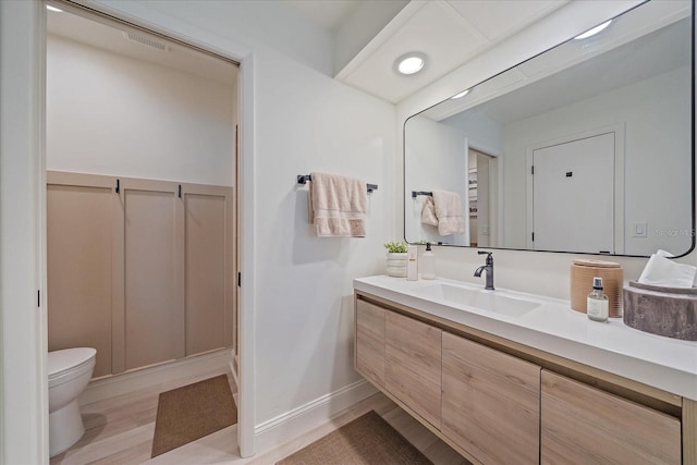 1211 Capri Isles Blvd Unit 6, Venice, FL 34292 - bathroom featuring toilet and vanity