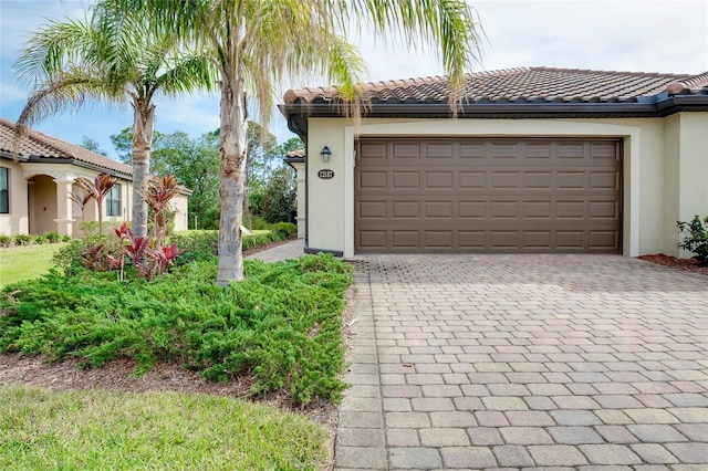 12187 Amica Loop, Venice, FL 34293 - garage featuring decorative driveway