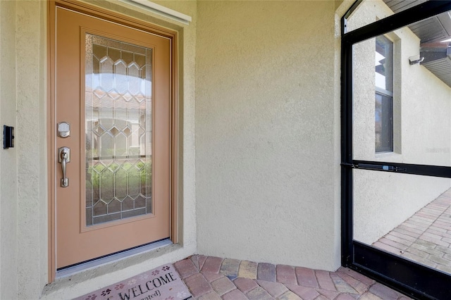 12187 Amica Loop, Venice, FL 34293 - entrance to property featuring stucco siding