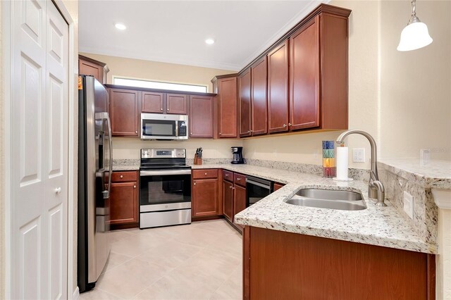 12187 Amica Loop, Venice, FL 34293 - kitchen with appliances with stainless steel finishes, a peninsula, light stone counters, pendant lighting, and light tile patterned floors