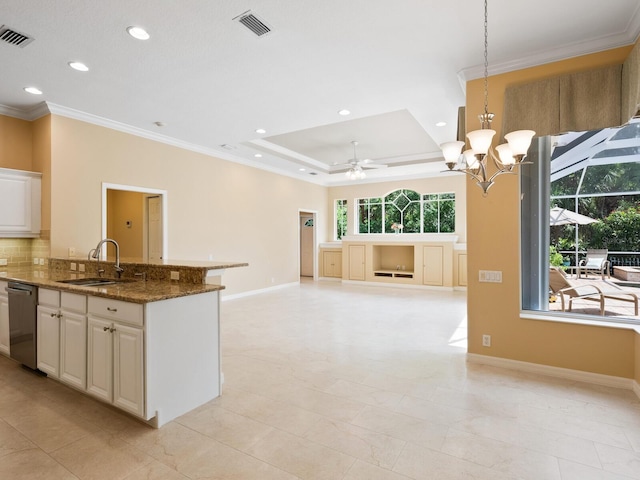 355 Swallow Cir, Venice, FL 34285 - kitchen with stainless steel dishwasher, crown molding, recessed lighting, a ceiling fan, and a chandelier