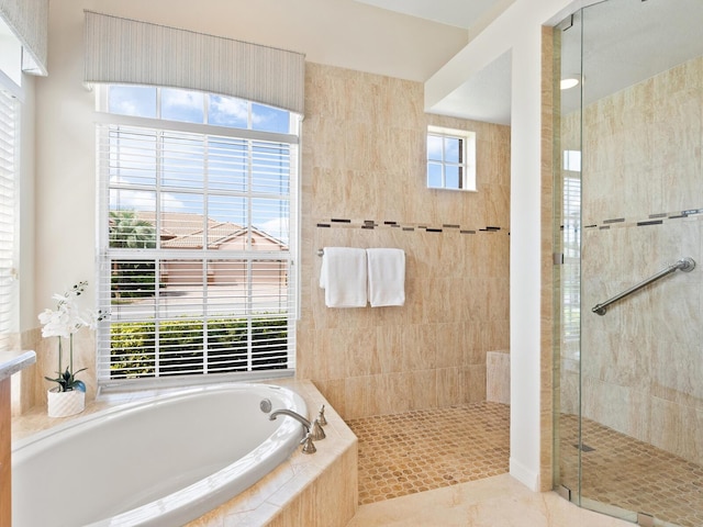 355 Swallow Cir, Venice, FL 34285 - bathroom with a garden tub, a shower stall, and tile patterned flooring