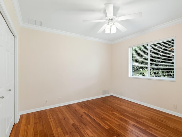 355 Swallow Cir, Venice, FL 34285 - unfurnished room featuring wood finished floors, crown molding, and a ceiling fan