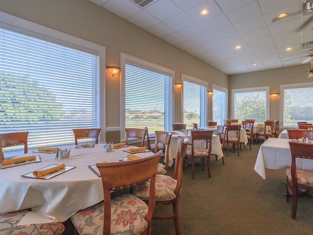 355 Swallow Cir, Venice, FL 34285 - carpeted dining space featuring a drop ceiling and ceiling fan