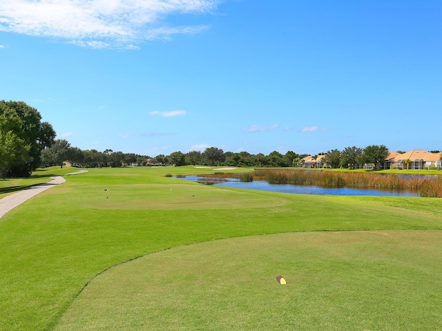 355 Swallow Cir, Venice, FL 34285 - view of community featuring a water view, golf course view, and a yard