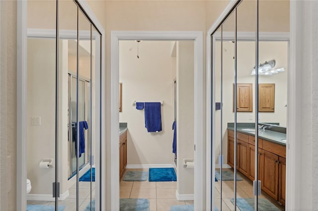 700 Gardens Edge Dr Unit 722, Venice, FL 34285 - bathroom featuring vanity, tile patterned flooring, and a shower with door