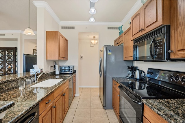 700 Gardens Edge Dr Unit 722, Venice, FL 34285 - kitchen with black appliances, ornamental molding, dark stone counters, brown cabinets, and light tile patterned floors