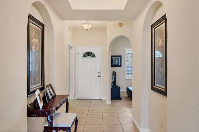 700 Gardens Edge Dr Unit 722, Venice, FL 34285 - foyer entrance featuring arched walkways and light tile patterned flooring
