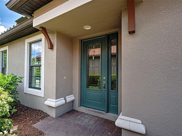 5832 Semolino St, Nokomis, FL 34275 - property entrance with stucco siding