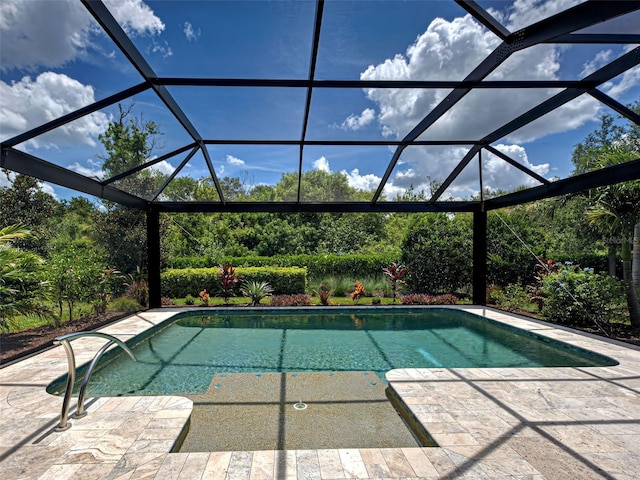 5832 Semolino St, Nokomis, FL 34275 - swimming pool featuring glass enclosure and a patio area