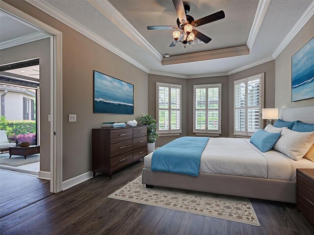 5832 Semolino St, Nokomis, FL 34275 - bedroom featuring a tray ceiling, dark wood-style floors, access to outside, crown molding, and a ceiling fan