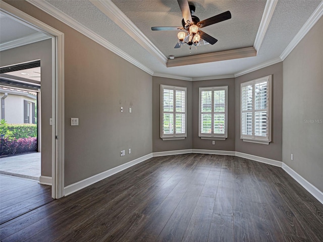 5832 Semolino St, Nokomis, FL 34275 - unfurnished room with dark wood-style flooring, a raised ceiling, a ceiling fan, crown molding, and a textured ceiling