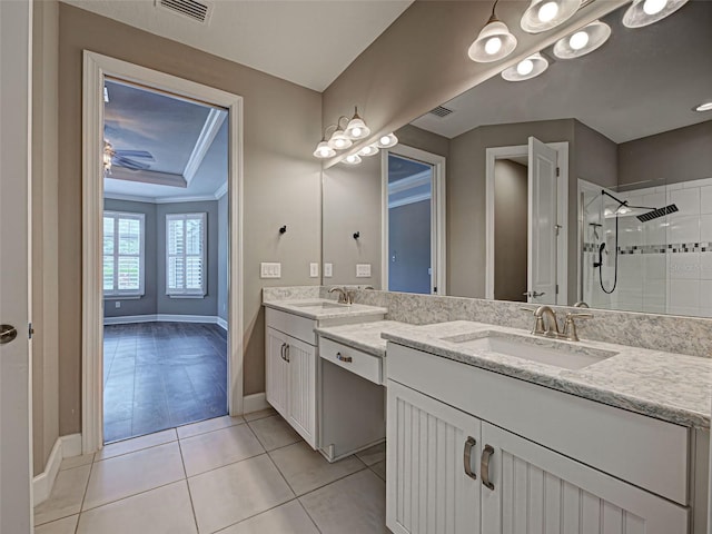 5832 Semolino St, Nokomis, FL 34275 - bathroom with double vanity, a stall shower, tile patterned floors, ceiling fan, and crown molding