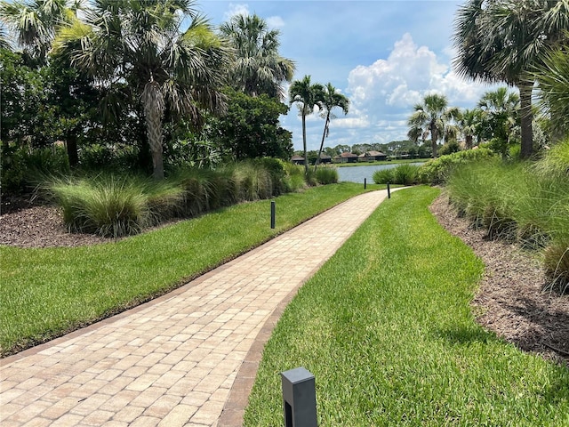 5832 Semolino St, Nokomis, FL 34275 - view of community featuring a lawn and a water view