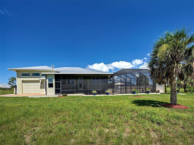 48 Lark Dr, Placida, FL 33946 - rear view of house featuring a yard and a sunroom