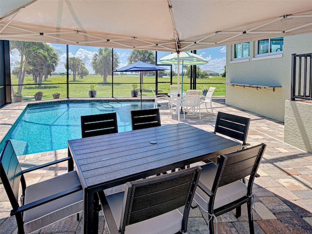 48 Lark Dr, Placida, FL 33946 - view of patio / terrace featuring outdoor dining space and an outdoor pool