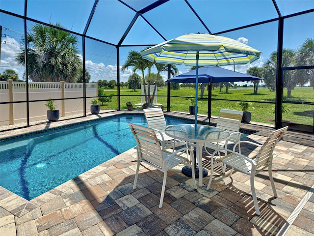 48 Lark Dr, Placida, FL 33946 - view of swimming pool with a patio area, glass enclosure, outdoor dining area, and a lawn