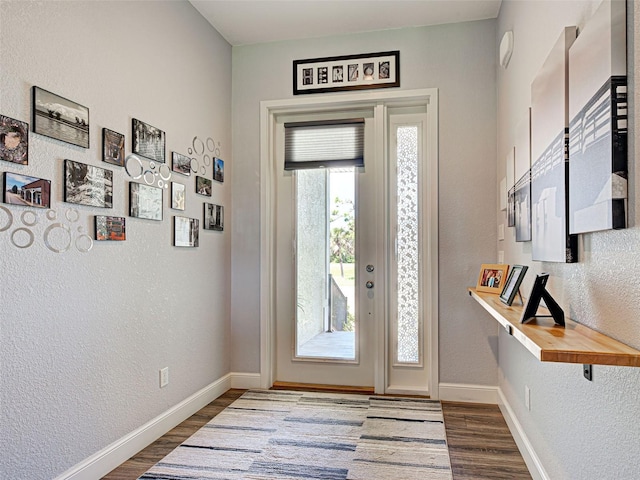 48 Lark Dr, Placida, FL 33946 - foyer with wood finished floors and a textured wall