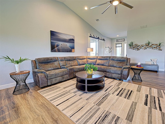 48 Lark Dr, Placida, FL 33946 - living area featuring vaulted ceiling, a ceiling fan, wood finished floors, and recessed lighting