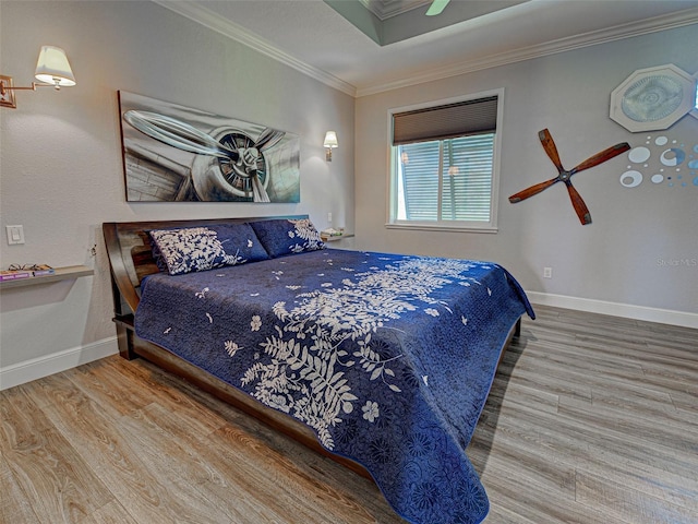 48 Lark Dr, Placida, FL 33946 - bedroom with wood finished floors, crown molding, and a ceiling fan