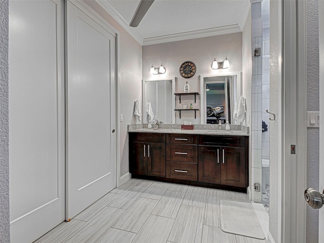 48 Lark Dr, Placida, FL 33946 - bathroom featuring crown molding, a stall shower, double vanity, and a textured wall
