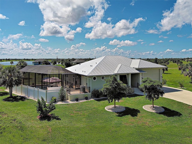 48 Lark Dr, Placida, FL 33946 - view of front of property featuring driveway, an attached garage, a front yard, and glass enclosure