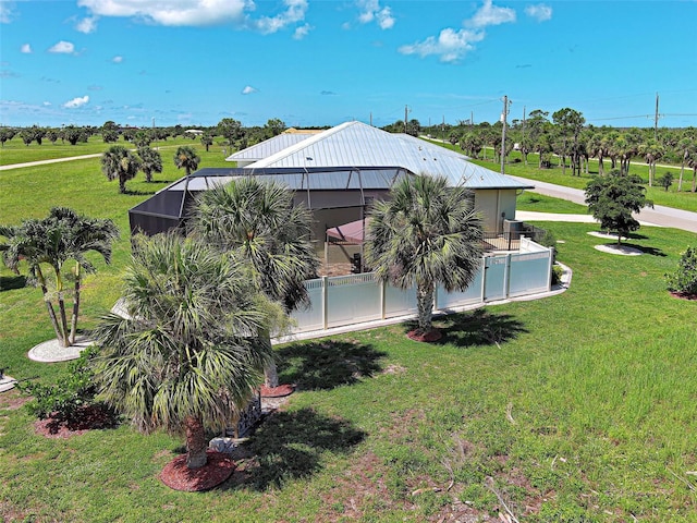48 Lark Dr, Placida, FL 33946 - rear view of house with a lanai and a metal roof
