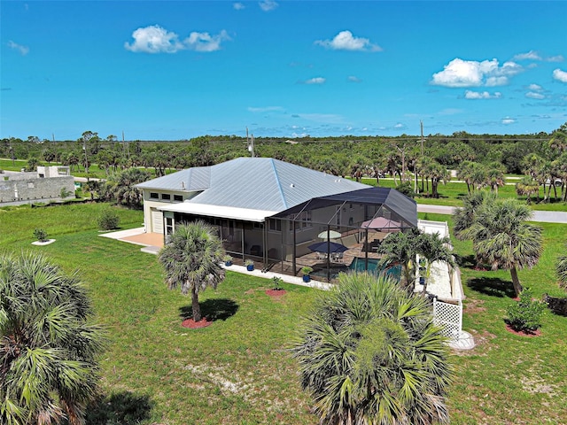 48 Lark Dr, Placida, FL 33946 - rear view of house with a patio, an outdoor pool, a yard, and glass enclosure