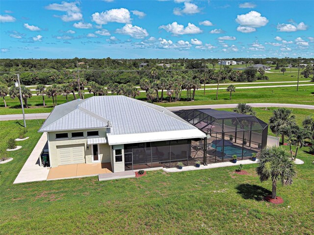 48 Lark Dr, Placida, FL 33946 - exterior space featuring a patio area, a swimming pool, and a lawn