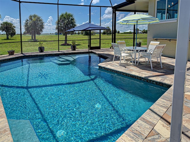 48 Lark Dr, Placida, FL 33946 - swimming pool with glass enclosure, a patio area, and a lawn