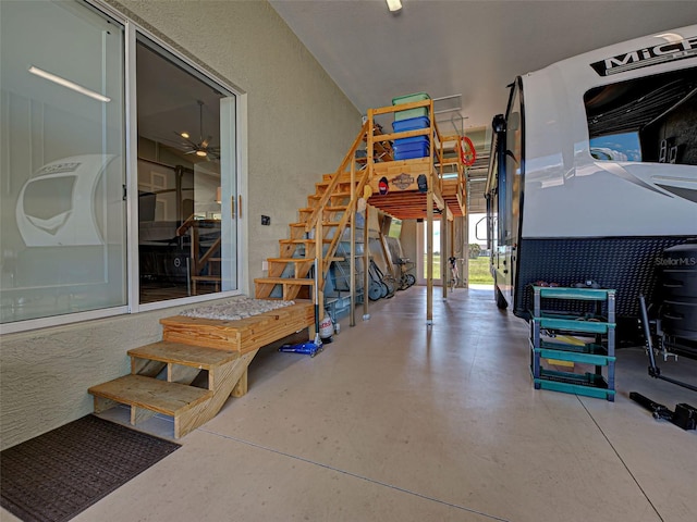 48 Lark Dr, Placida, FL 33946 - garage featuring a textured wall and ceiling fan