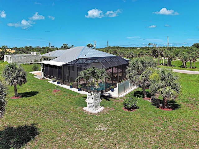 48 Lark Dr, Placida, FL 33946 - view of grassy yard featuring a pool, glass enclosure, and a patio