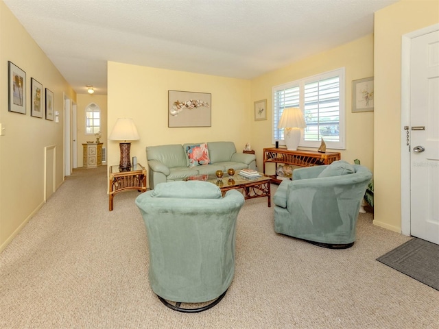 168 The Corso Unit 168, Venice, FL 34285 - carpeted living area with baseboards