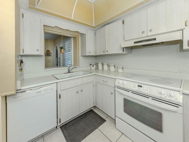 168 The Corso Unit 168, Venice, FL 34285 - kitchen featuring white appliances, under cabinet range hood, light countertops, and light tile patterned floors