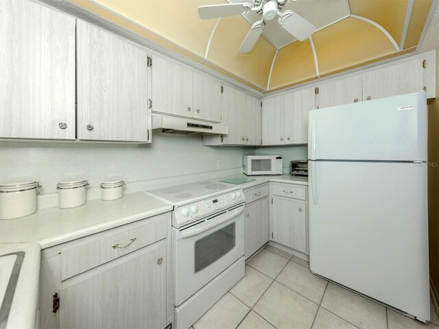 168 The Corso Unit 168, Venice, FL 34285 - kitchen featuring white appliances, under cabinet range hood, light countertops, light tile patterned floors, and a ceiling fan