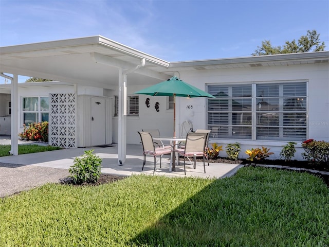 168 The Corso Unit 168, Venice, FL 34285 - view of patio / terrace with a carport
