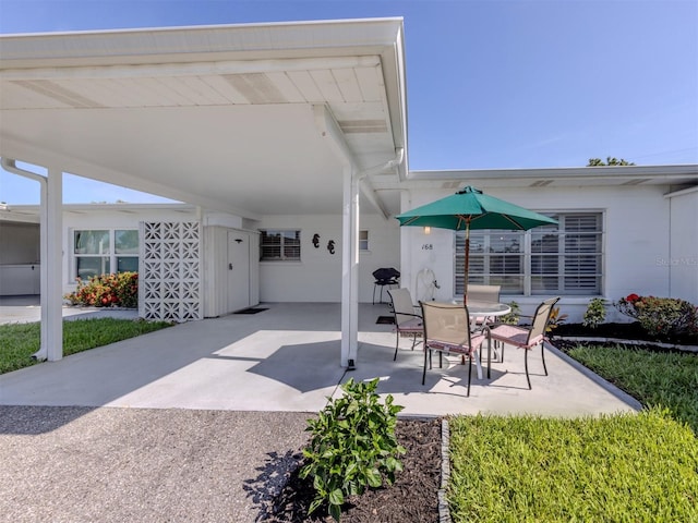 168 The Corso Unit 168, Venice, FL 34285 - view of patio / terrace featuring a carport