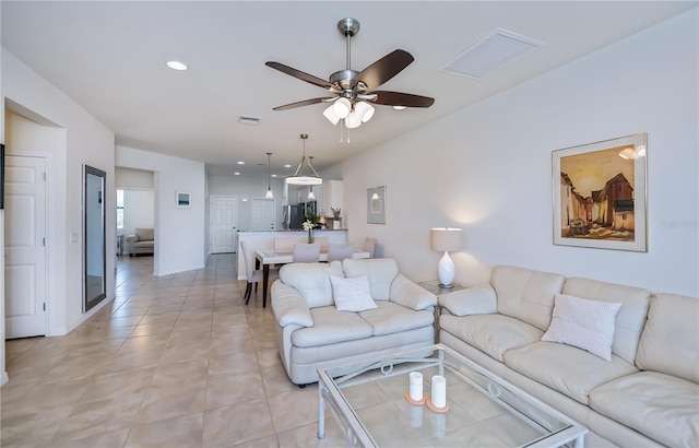19269 Serafina St, Venice, FL 34293 - living room featuring a ceiling fan, recessed lighting, and light tile patterned floors