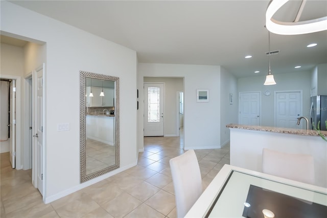 19269 Serafina St, Venice, FL 34293 - unfurnished dining area with light tile patterned floors and recessed lighting
