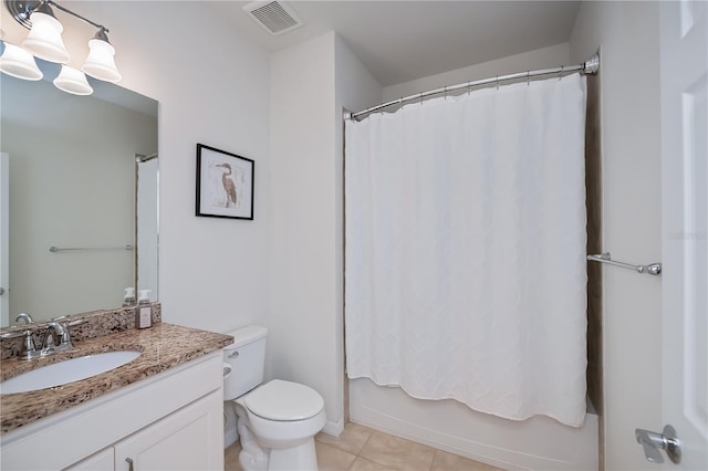 19269 Serafina St, Venice, FL 34293 - bathroom featuring vanity, tile patterned floors, and shower / bath combo with shower curtain
