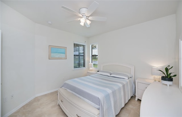 19269 Serafina St, Venice, FL 34293 - bedroom with light tile patterned floors and ceiling fan