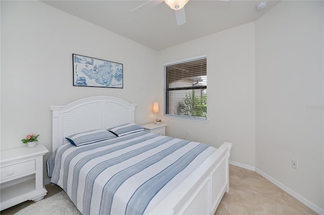 19269 Serafina St, Venice, FL 34293 - bedroom with ceiling fan and light tile patterned floors